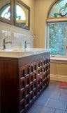 A custom build 60" vanity cabinet with one of a kind rose wood door & drawer fronts with a integrated sink