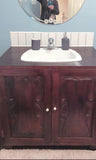 - Vanity cabinet with amazing hand carved rose wood door panels.  - 36" x 24" x 35" (ht)
