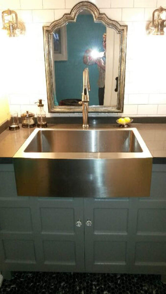 We customized a 24" deep cabinet so it can accommodate a farmhouse sink, which  typically is used  in a kitchen.  The sink being big & deep, the vanity can also be used as wash station for smaller pets.  - 48" x 24" x 35" (ht)