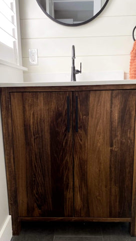 This gorgeous modern clean line bathroom vanity built from solid poplar wood with a white quartz  top and a ceramic sink adds a perfect rustic & warn touch to this bathroom.