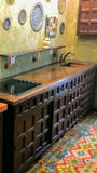 Joe's very unique kitchen with one of kind  rose wood door & drawer panels  and custom copper counter top & sink. Creating a rustic & farmhouse like ambience.
