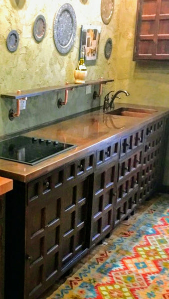 Joe's very unique kitchen with one of kind  rose wood door & drawer panels  and custom copper counter top & sink. Creating a rustic & farmhouse like ambience.