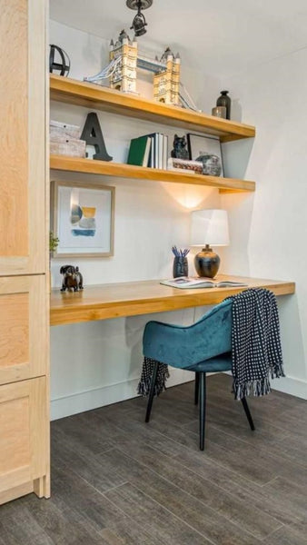 Don’t think you have the space for a home office? Think again  In this condo, hallway becomes a home office. To make the most of the space, a floating desk and shelving above it makes room for books,etc  Made from solid poplar wood.