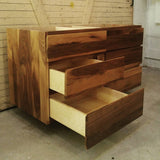 This floating 48" vanity cabinet is built from beautiful solid walnut wood , with exceptional grain pattern throughout.  Transforming the bathroom into an organic and contemporary space.    The vanity is made up of 6 soft close drawers with integrated lip handle - providing ample of storage space.  A perfect combination of functionality and style!