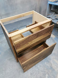 Shown in the photos is a 31" wide custom vanity cabinet built from gorgeous solid walnut wood.