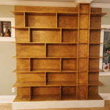 MCM inspired bookcase for a living/dining area - open concept space!   7 ft wide shelves running through from one end to another with open ends.  A  multi functional  sturdy & solidly build from maple plywood standing 8ft tall.