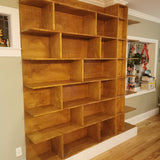 MCM inspired bookcase for a living/dining area - open concept space!   7 ft wide shelves running through from one end to another with open ends.  A  multi functional  sturdy & solidly build from maple plywood standing 8ft tall.