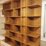 MCM inspired bookcase for a living/dining area - open concept space!   7 ft wide shelves running through from one end to another with open ends.  A  multi functional  sturdy & solidly build from maple plywood standing 8ft tall.