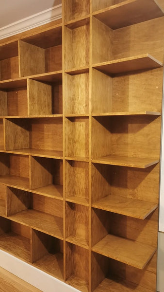 MCM inspired bookcase for a living/dining area - open concept space!   7 ft wide shelves running through from one end to another with open ends.  A  multi functional  sturdy & solidly build from maple plywood standing 8ft tall.