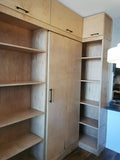This built-in not only add  lot of storage & display space but also works as a pantry hidden behind the sliding door for a condo with limited space.