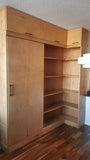 This built-in not only add  lot of storage & display space but also works as a pantry hidden behind the sliding door for a condo with limited space.