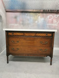 The vintage dresser was modified to accommodate the plumbing  including  new under-mount soft close  drawer boxes with cut outs and white quartz top with an under-mount sink.  Allowing the luxurious vintage look & feel but also the modern convenience & functionality.