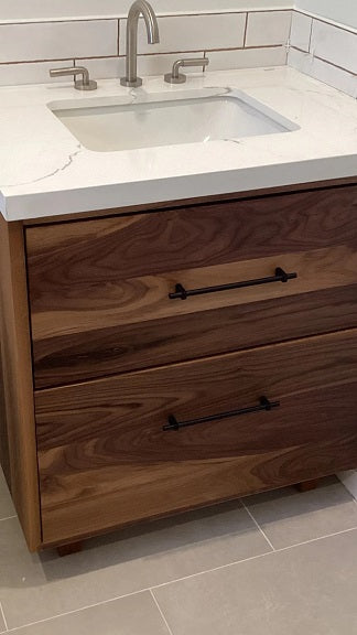 Shown in the photos is a 31" wide custom vanity cabinet built from gorgeous solid walnut wood.