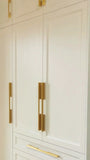 U shaped custom closet, designed to fit this unique space in a third floor bedroom of downtown house, featuring inset shaker style fronts with bead design and a gorgeous black closet island with additional drawers & pull out for a laundry hamper.  The closets provide ample hanging, drawer, and shelf space for clothing , etc. 