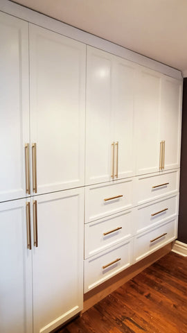 A custom closet, designed to fit this unique & unusual space for a 2nd floor bedroom of a downtown house, Featuring shaker style fronts with bead design and cabinet boxes & drawers boxes build from a gorgeous maple wood plywood. The closets provide ample hanging, drawer, and shelf space for clothing, etc.