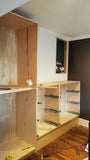 A custom closet, designed to fit this unique & unusual space for a 2nd floor bedroom of a downtown house, Featuring shaker style fronts with bead design and cabinet boxes & drawers boxes build from a gorgeous maple wood plywood. The closets provide ample hanging, drawer, and shelf space for clothing, etc.