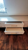 A 10 ft long custom build dresser unit for an awkward space, boast 8 soft close drawers with under mount slides . A sleek and streamlined white exterior  with recessed kick.   Making the space equal part functional and chic!!