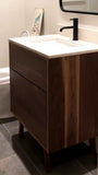 Custom build MCM inspired 30" solid walnut wood vanity​ cabinet​, featuring one deep soft close inset drawer ​, tapered wood legs, quartz countertop  with gray veins and a ceramic sink. 