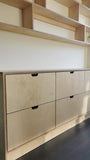 This handsome unit is built from Baltic birch plywood.   Due to the nature of its construction, it is an incredibly durable and void free core allows for a decorative exposed edge.  Cabinet has a  modern ​clean​ &​​ ​streamlined look​, boasting 6 soft close drawer with cut out handle pulls. The shelving is floating between the cabinet & ceiling and has rounded edges
