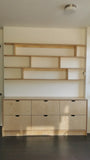 This handsome unit is built from Baltic birch plywood.   Due to the nature of its construction, it is an incredibly durable and void free core allows for a decorative exposed edge.  Cabinet has a  modern ​clean​ &​​ ​streamlined look​, boasting 6 soft close drawer with cut out handle pulls. The shelving is floating between the cabinet & ceiling and has rounded edges