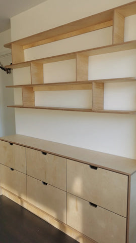 This handsome unit is built from Baltic birch plywood.   Due to the nature of its construction, it is an incredibly durable and void free core allows for a decorative exposed edge.  Cabinet has a  modern ​clean​ &​​ ​streamlined look​, boasting 6 soft close drawer with cut out handle pulls. The shelving is floating between the cabinet & ceiling and has rounded edges
