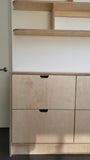 This handsome unit is built from Baltic birch plywood.   Due to the nature of its construction, it is an incredibly durable and void free core allows for a decorative exposed edge.  Cabinet has a  modern ​clean​ &​​ ​streamlined look​, boasting 6 soft close drawer with cut out handle pulls. The shelving is floating between the cabinet & ceiling and has rounded edges