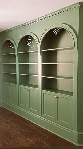 To restore a Victorian house back to its original splendor the bookshelf  was designed with three architecturalarches with carved half columns, open adjustable shelves on top and double doors at the bottom.     The crown molding on top and the original restored baseboard at the bottom gives it a complete builtin aesthetic!