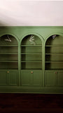 To restore a Victorian house back to its original splendor the bookshelf  was designed with three architecturalarches with carved half columns, open adjustable shelves on top and double doors at the bottom.     The crown molding on top and the original restored baseboard at the bottom gives it a complete builtin aesthetic!