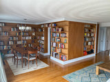 A librarian's (our client) dream home library and TV Unit.  Incredible MCM inspired library/ bookcase and built in TV unit featuring a stunning sliding door.  The bookcase  which stretches over 30ft ​ boast ​seven shelves ​running all the way through ​offering plenty of ​ ​display space for books, art, ​etc​  TV unit is hidden with a beautiful 54" wide sliding door oozing out Danish charm and practicality.