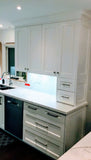 Shaker style cabinets are popular for their timeless style & ability to complement traditional, transitional & modern designs.  Combined with distinctive glass front doors with intersecting narrow strips of wood that divide individual panes of glass – giving the cabinet doors an elegant demeanor well suited for showing off special pieces of china or silver.