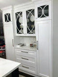 Shaker style cabinets are popular for their timeless style & ability to complement traditional, transitional & modern designs.  Combined with distinctive glass front doors with intersecting narrow strips of wood that divide individual panes of glass – giving the cabinet doors an elegant demeanor well suited for showing off special pieces of china or silver.