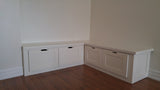 Prefer the look of a built-in piece that’s custom-fit to your space?  Go for a banquette with drawers in its base to keep special-occasion linens, seasonal accents and serving pieces neatly tucked away.  By doing able, Laura was able to convert this small corner into  equal part chic and functional.  60" x 60" x 17"