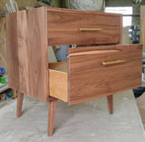 Custom build  MCM inspired 30" solid walnut wood vanity​ cabinet​, featuring a ​soft closing drawer ​and​ solid wood tapered legs. ​ ​With sturdy gold handles adding timeless touch to cabinetry  An elegant addition to any bath space, unique and beautiful texture​d walnut wood makes ​​bathroom classic,​ ​luxurious​ and stunning.