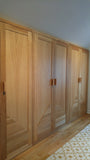 Storage solutions to create both functional and beautiful space - A closet with solid oak wood doors,designed to fit a room with ceiling at an angle.  11.5ft (W) x 6.5ft (HT) x 2ft(D)