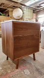 Custom build MCM inspired 30" solid walnut wood vanity​ cabinet​, featuring one deep soft close inset drawer ​, tapered wood legs, quartz countertop  with gray veins and a ceramic sink. 