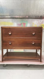 The hand-crafted solid walnut wood bathroom vanity boasts  2 deep soft close drawers and a storage shelf.  A unique & sleek design featuring tapered legs, 1/4" reveal at the top,  & inset drawers which are set back 1/4" to reveal the frame.  The concave walnut wood pulls/knob gives the cabinet a retro / mid-century feel