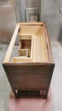 The hand-crafted solid walnut wood bathroom vanity boasts  2 deep soft close drawers and a storage shelf.  A unique & sleek design featuring tapered legs, 1/4" reveal at the top,  & inset drawers which are set back 1/4" to reveal the frame.  The concave walnut wood pulls/knob gives the cabinet a retro / mid-century feel