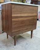 Custom build 30" solid walnut wood vanity​ cabinet​, featuring ceramic ​under-mount​ sink and white quartz countertop, ​soft closing drawers ​and​ solid wood tapered legs. ​ ​ An elegant addition to any bath space, unique and beautiful texture​d walnut wood makes ​b​bathroom classic,​ ​luxurious​ and stunning.