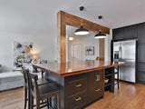 We built this amazing island with solid maple wood counter top for Neve last summer. This time around it was time to add a rustic architectural feature to this beautiful kitchen by covering the post & beam with solid maple wood.