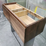 48" floating vanity built from solid walnut wood.  Drawer fronts are grained match- grain pattern flows beautifully from one drawer to other.  3 functional drawer with fully extendable under mount soft close slides.  Routed integrated finger pull for a minimalist look