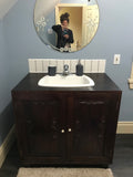 36" wide vanity cabinet with amazing hand carved rose wood door panels.