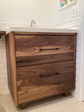 Shown in the photos is a 31" wide custom vanity cabinet built from gorgeous solid walnut wood.