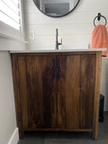 This gorgeous modern clean line bathroom vanity built from solid poplar wood with a white quartz  top and a ceramic sink adds a perfect rustic & warn touch to this bathroom.