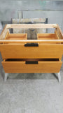 36" wide wall​ mounted / floating solid oak vanity built from solid white oak and stained teak color. ​ Design is inspired by Liz's love for MCM furniture - A​  ​modern ​clean​ &​​ ​streamlined look​ with two soft close drawers​ and 7"  black edge pulls.