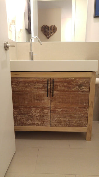 This gorgeous clean line bathroom vanity cabinet is custom designed & built to fit an existing vanity top.  Frame build from poplar wood and door panels from reclaimed teak wood.  -34" x 20 " x 28" (ht)