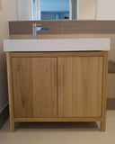 This gorgeous clean line bathroom vanity cabinet.  Custom designed & built to fit an existing floating vanity top.  Frame & door panels built from solid polar wood,  -34" x 20 " x 28" (ht)